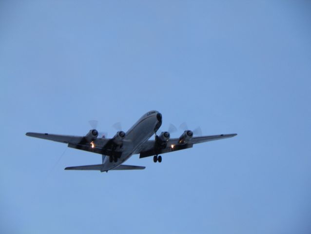 Douglas DC-6 — - If you look at the a/c you will see the contrails from the flaps. Our humidity was at 84%25 and it had just snowed like 45 minutes before.