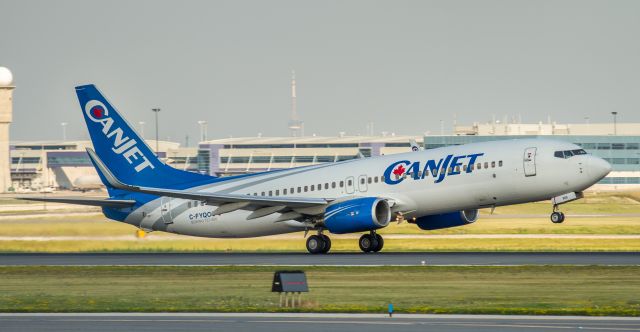 Boeing 737-800 (C-FYQO) - Canjet just announced they have ceased operations. This particular aircraft is now in the hangar receiving Air Transat paint and titles.