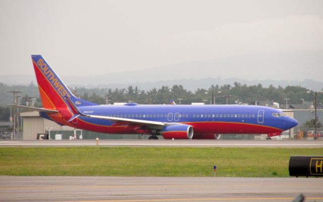 Boeing 737-800 (N8600F) - Southwest 737-800 with Split Scimitar Winglets taxiing for departure on runway 17 at Manchester Boston Regional Airport.