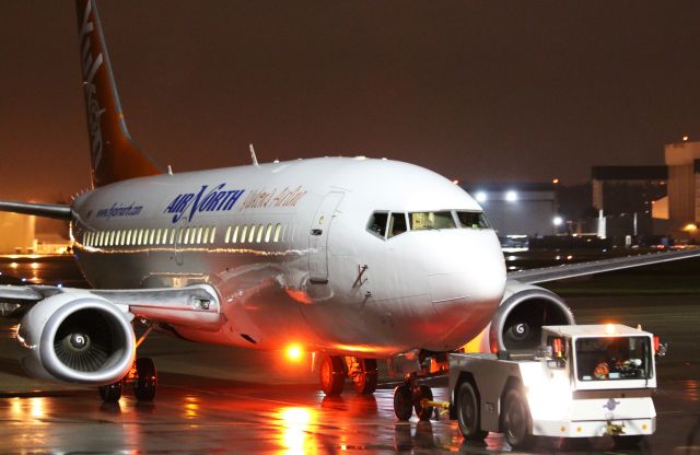 Boeing 737-500 (C-GANJ) - Air North 737 being towed to the parking stand for overnight at YVR