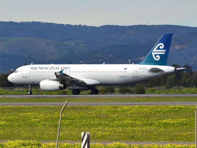 Airbus A320 (ZK-OJI) - Rolling for take off on runway 05, for flight home to Auckland, New Zealand. Thursday 12th July 2012.