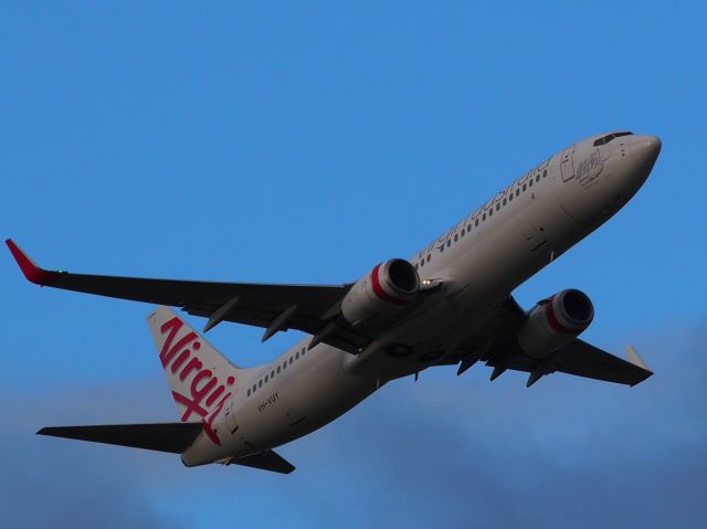 Boeing 737-700 (VH-VUY) - Evening takeoff on runway 23, Adelaide International Airport. Photo taken from Tapleys Hill Road viewing area.