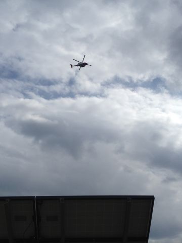 — — - Coast guard jhawk decided to do a flyby of the Wright Brothers monument