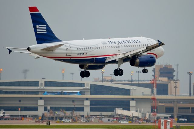 Airbus A319 (N832AW) - U.S. Airways A319 N832AW arriving DFW on a rainy overcast day 05/09/2013