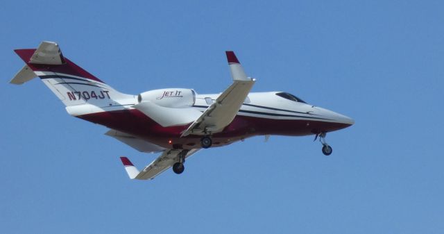 Honda HondaJet (N704JT) - On short final is this 2021 Honda HondaJet 420 in the Spring of 2022.