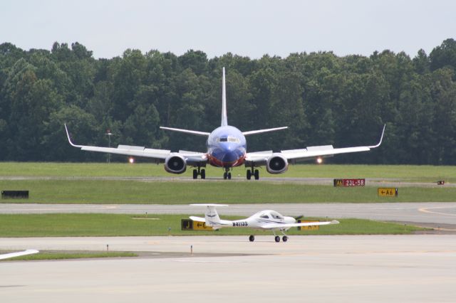 BOEING 737-300 (N389SW) - N389SW exiting runway 5R