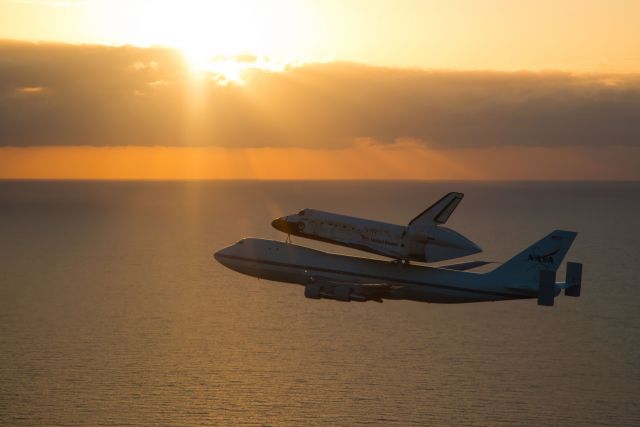 Boeing 747-200 (NASA905) - NASA 905 and Discovery shortly after takeoff from the Shuttle Landing Facility, Kennedy Space Center.