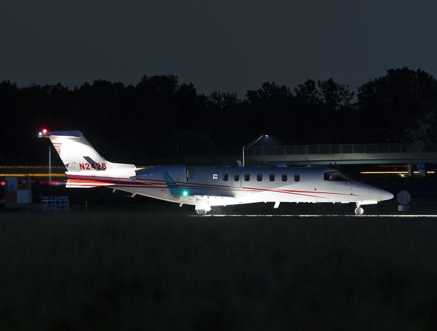 Learjet 45 (N2426) - I cheated on this one and used an improvised tripod as the Bombardier Lear45 waited for clearance to take the runway last night, 25 Aug 2022.