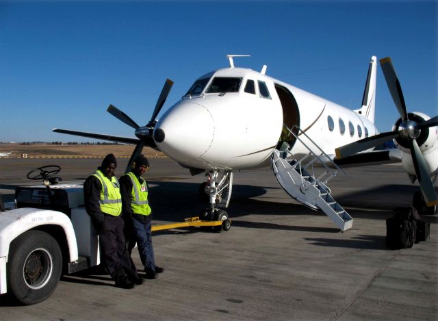 Grumman Gulfstream 1 (ZS-JIS) - The King Air Charter line crew at Lanseria