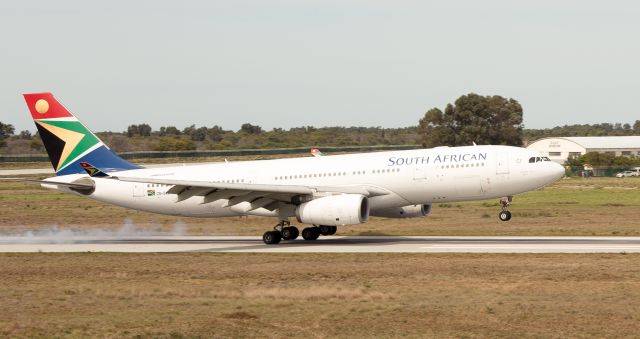 Airbus A330-200 (ZS-SXZ) - A very rare and unusual visitor to our very small local airport. This past weekend saw an influx of over 6000 athletes to our city (read : town) for the Iron Man Competition. On Tuesday 4 September our National Carrier had to replace the usual 11:00 am flight (SA405) of either an A319 or A320, with this wide-body A330-243. Not only for the large number of International athletes heading back to Johannesburg, but also for the Cargo. Besides the usual "baggage", there were also a few hundred bicycles that needed to be loaded up. Flight SA405 (SA410 return) operated the A332 on both Tues & Wed to accommodate all the extra passengers and their unusual cargo.  With a runway length of less than 6,700 foot it becomes a tight fit for this big bird. The apron is too narrow to park "normally" and therefore she had to park at an angle. Being at sea level, and with a typical wind blowing, besides the parking space, our little airport can handle it. The last time a aircraft of comparable size visited our airport was in 2010 for the Soccer World Cup.