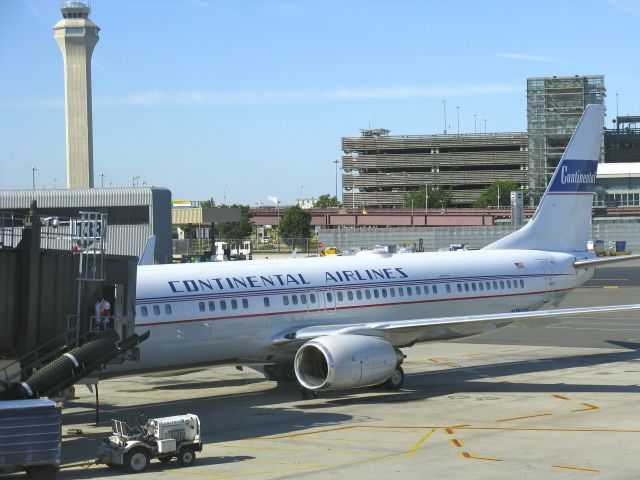 Boeing 737-900 (N75436) - Continental Airlines Retro Jet  Livery at Newark International Airport (KEWR) on June 24, 2012. This flight was going to Houston Bush International Airport (KIAH). In the background of this picture you can see the Newark Airport Control Tower. N75436 is at Gate C133.