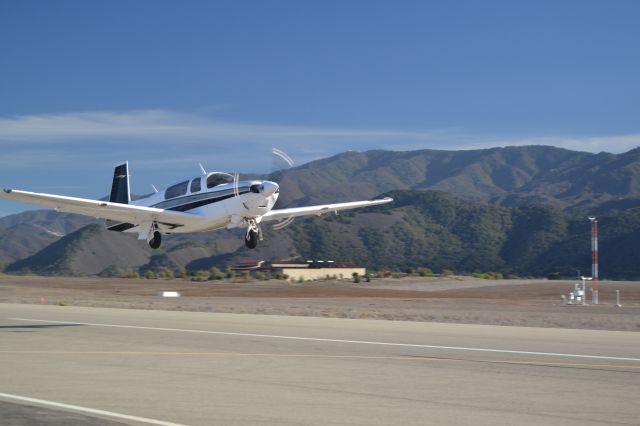 PZL-MIELEC Dromader Mini (N711WZ) - Mooney TLS departs Santa Ynez Valley Airport runway 26 on a crisp November afternoon.