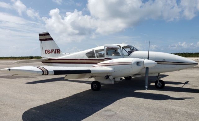 Piper Aztec (C6-FJR) - Parked on the ramp at Chub Cay, Bahamas.