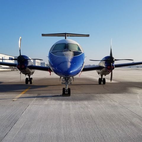 Embraer EMB-120 Brasilia (N126CZ) - Cold overnight temps and a rising sun mean a frost covered ramp and airplane with gradual melting on both.