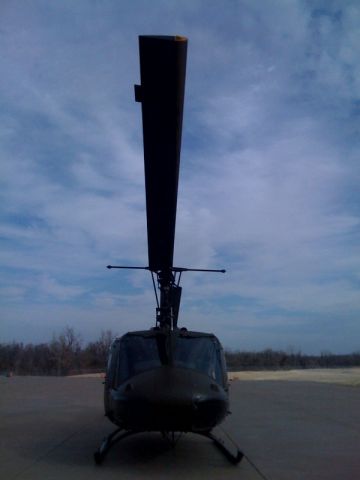 — — - Looking right down the nose of the Huey.