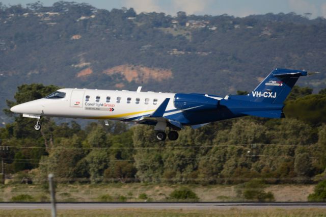 Learjet 45 (VH-CXJ) - About to put down on runway 05. Wednesday, 21st May 2014.