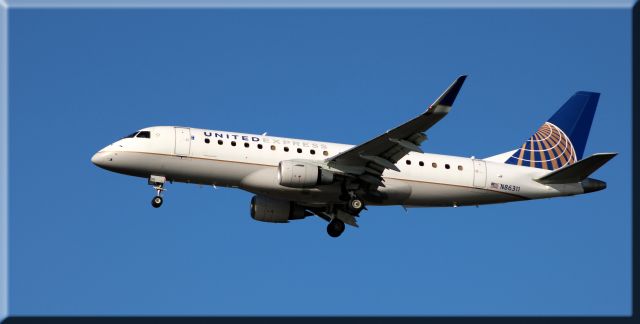 Embraer 175 (N86311) - On final is this 2014 United Airlines Express Embraer 175LR in the Autumn of 2020.
