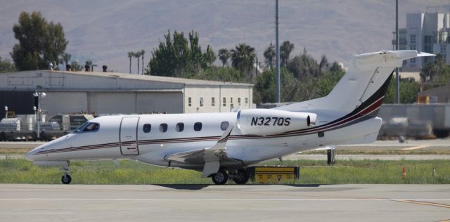 Embraer Phenom 300 (N327QS) - Awaiting departure clearance on 30L, to KSIY  06-13-2015