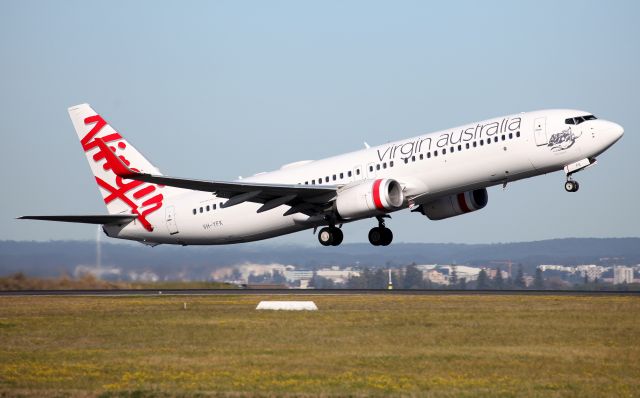 Boeing 737-800 (VH-YFK) - Lifting Off from Rwy 34R