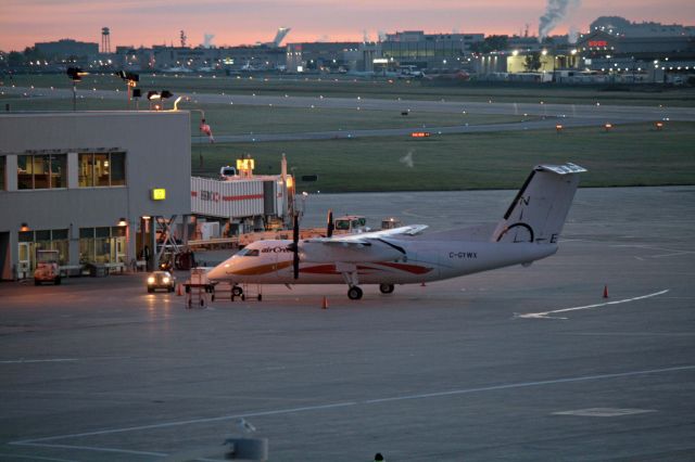 de Havilland Dash 8-100 (C-GYWX) - Early morning shot from the Parking garage roof at CYUL