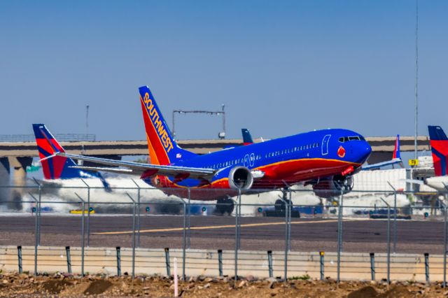 Boeing 737 MAX 8 (N872CB) - A Southwest Airlines 737 MAX 8 in Canyon Blue retro livery taking off from PHX on 3/4/23. Taken with a Canon R7 and Canon EF 100-400 L II lens.