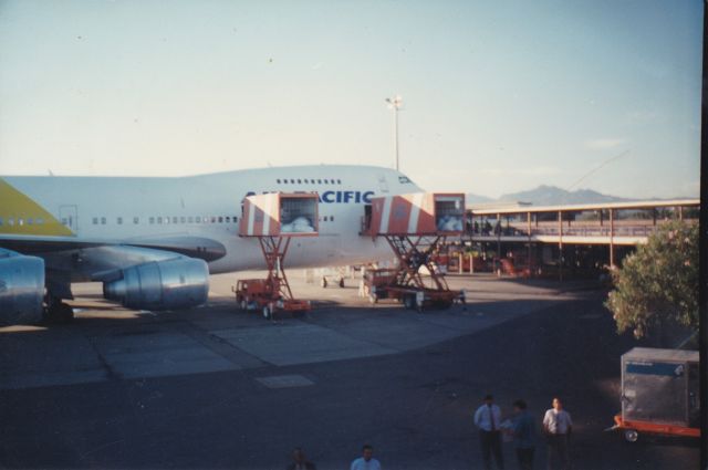 Boeing 747-200 (ZK-NZY) - WOW This was a great photo i had taken back in 1996 when air new zealand leased this Boeing 747-219 to the Fijian carrier here at gate 3 awaiting a final flight to be repainted back into the air new zealand decals nice aircraft