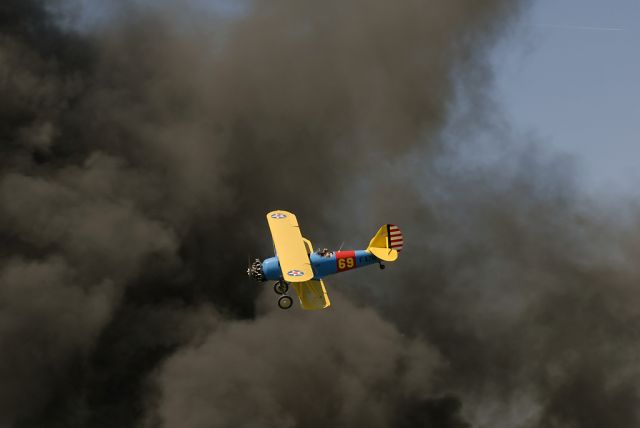 F-AZNF — - Flying in front of a huge fire after a simulated "Pearl Harbour Attack" at the La Ferté-Alais airshow 2012