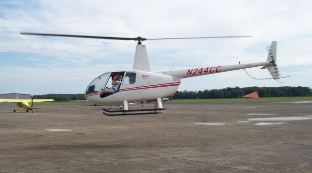 Robinson R-44 (N244CC) - Departing THA after a quick refuel enroute to the Bonnaroo Music Festival in Manchester TN.  Helicopter was working as a VIP transport for festival organizers.