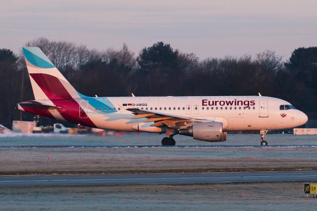 Airbus A319 (D-ABGQ) - EWG9341 on the way back to Dusseldorf as the sun rises on a cold day in Manchester