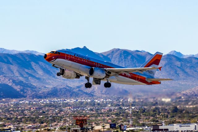 Airbus A319 (N742PS) - American Airlines A319 in PSA retro livery taking off from PHX on 10/29/22. Taken with a Canon 850D and Tamron 70-200 G2 lens.