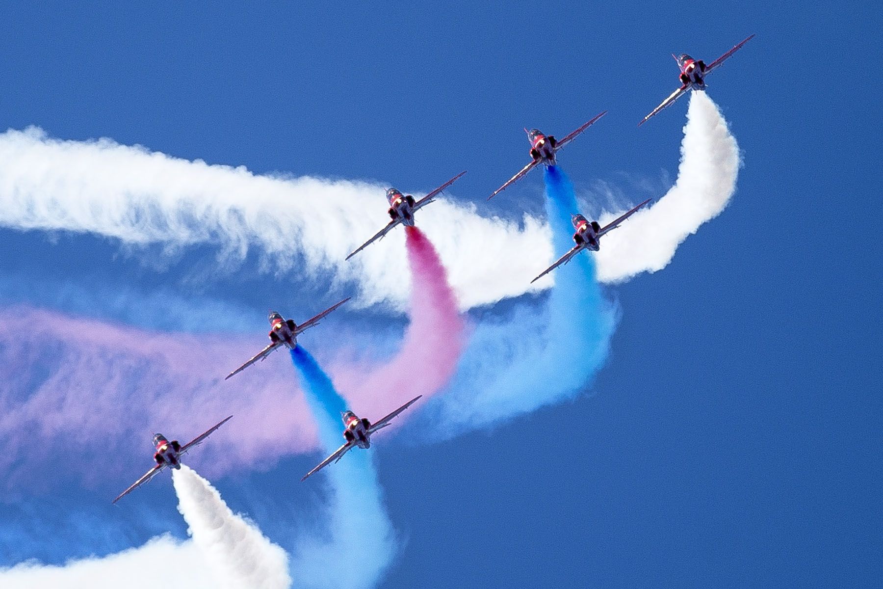 — — - Red Arrows start their show at RAF Battle of Britain Day on Jersey Channel Islands UK Sept 2012. Image taken from St Helier Harbour with Canon idx/300 2.8 lens - the Red Arrows truly tested the autofocus system which kept up in AF servo mode. Interestingly 9 Red Arrows flew into Jersey, but just 7 took part in the display. Still fantastic .......