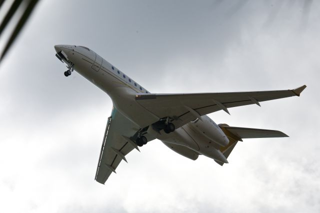 Bombardier Global 5000 (D-ACDE) - Bombardier BD-700, Global 5000 lifts off into a grey sky from Sint Maarten's Rwy 10. Jan 4, 2013