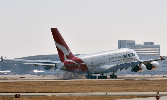 Airbus A380-800 (VH-OQJ) - Smoking a little, taken from Founders Plaza. SYD-DFW.