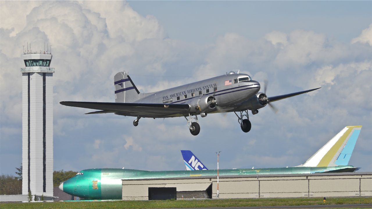 Douglas DC-3 (N877MG) - Historic Flight Foundations Douglas DC-3 (Ser#4193) climbs from Rwy 16R for a flight on 9.21.13.