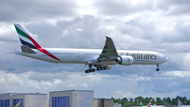 BOEING 777-300 (A6-ENQ) - BOE213 on final to Rwy 16R to complete a flight test on 5/19/14. (LN:1201 / cn 41363).