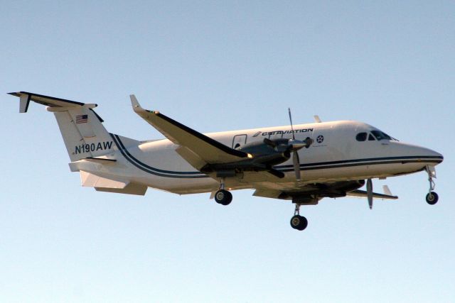 Beechcraft 1900 (N190AW) - On short finals for rwy 32 on 20-Nov-19.