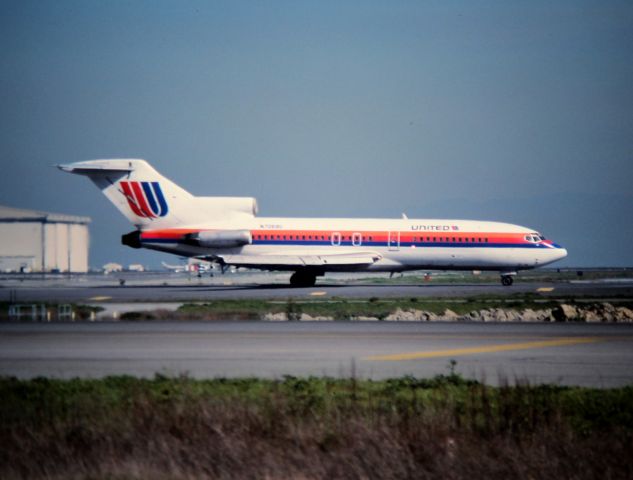Boeing 727-100 (N7068U) - KSFO - UAL holding short of 1L departure runway at SFO - early 1980s from Airport rd.view looking east.
