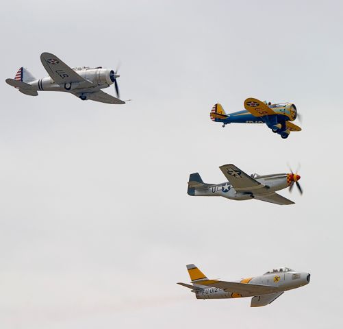 N3378G — - What a great flyby! Clockwise from upper left, a Republic AT-12 Guardsman, a Boeing P-26 Peashooter, a North American P-51D Mustang and a North American F-86 Sabre make some noise in the sky above Chino airport.