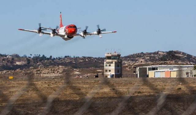 — — - Aero Union P3 Orion firefighting aircraft on low pass out of Ramona, California.