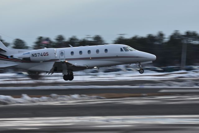 Cessna Citation Excel/XLS (N574QS) - A Netjets Cessna Citation Excel 56/XLS gets ready to touchdown on a snow cleared runway at Monmouth Airport Feb. 2021.