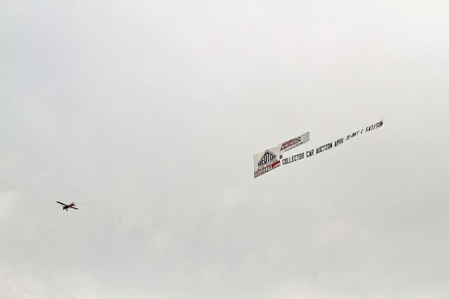 Piper L-21 Super Cub (N143CC) - It was a banner day over the Charlotte Motor Speedway, Concord, North Carolina USA