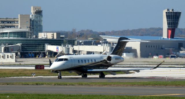 Canadair Challenger 350 (N581FX) - taxiing for departure is this 2016 Bombardier Challenger 350 in the Autumn of 2023.