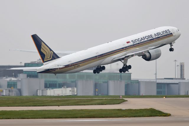 BOEING 777-300ER (9V-SWK) - All quiet on Terminal 3, in the background, as SIA327 departs on the short hop to Munich before the 12hr flight back home.