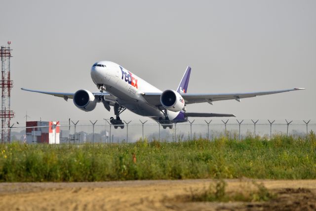 BOEING 777-200LR (N891FD) - Runway 23-L bound for CDG on 08-05-21