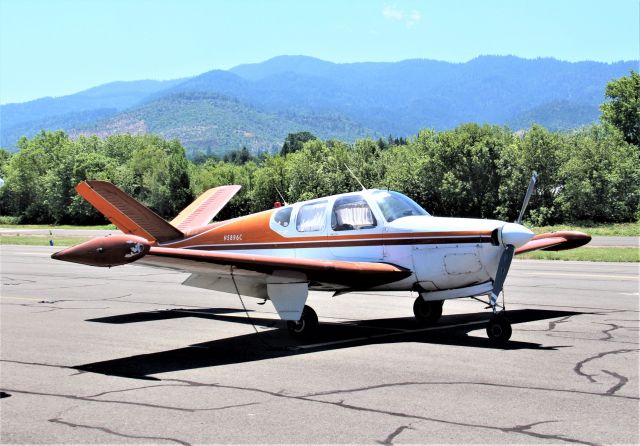 Beechcraft 35 Bonanza (N5896C) - KSO3 - we were cruising Ashland OR USA July 4 2020 and this 1951 Bonanza was on a back taxi to the ramp. Tied down the people from the plane were calling Uber or Lyft for a ride to downtown Ashland.