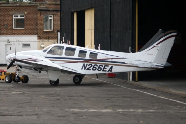 Beechcraft Baron (58) (N266EA) - About to disappear into the hangar on 2-Jul-15.