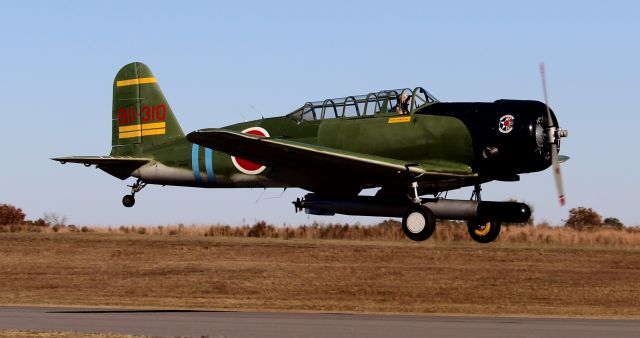 North American T-6 Texan (N7062C) - Alan Armstrong's Nakajima B5N2 Kate replica about to touch down at Folsom Field, Cullman Regional Airport, AL - late afternoon, November 3, 2023 as part of the 2023 Cullman Veteran's Day Celebration the next day at the airport. 