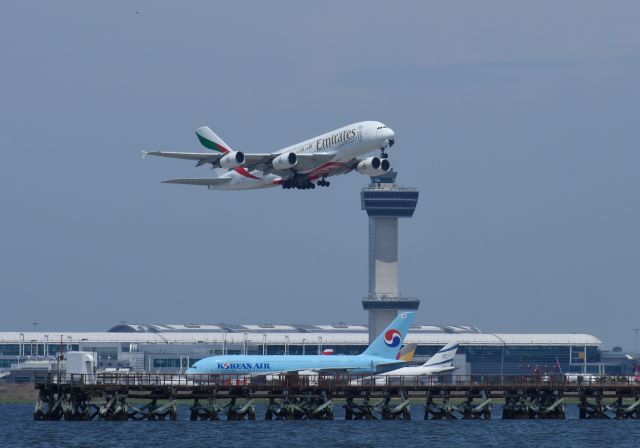 Airbus A380-800 (A6-EEK) - Emirates A380 taking off from runway 13R with Kennedy Tower and a Korean A380 in the background. Pic taken with a Nikon D7200.