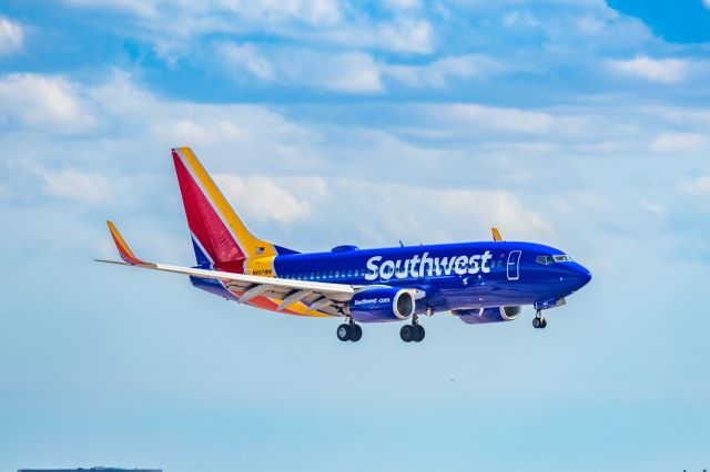 Boeing 737-700 (N497WN) - A Southwest Airlines 737-700 landing at PHX on 2/28/23. Taken with a Canon R7 and Canon EF 100-400 L ii lens.