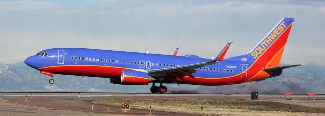 Boeing 737-800 (N8303R) - Landing on 16L.